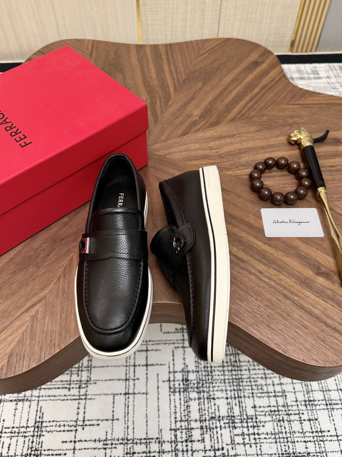 Salvatore Ferragamo Black Loafers with White Soles — front