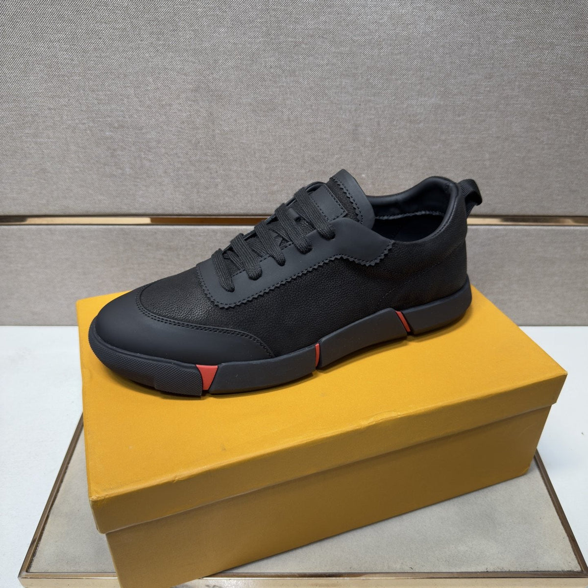 Louis Vuitton Black Low-Top Sneakers with Red Accents — front