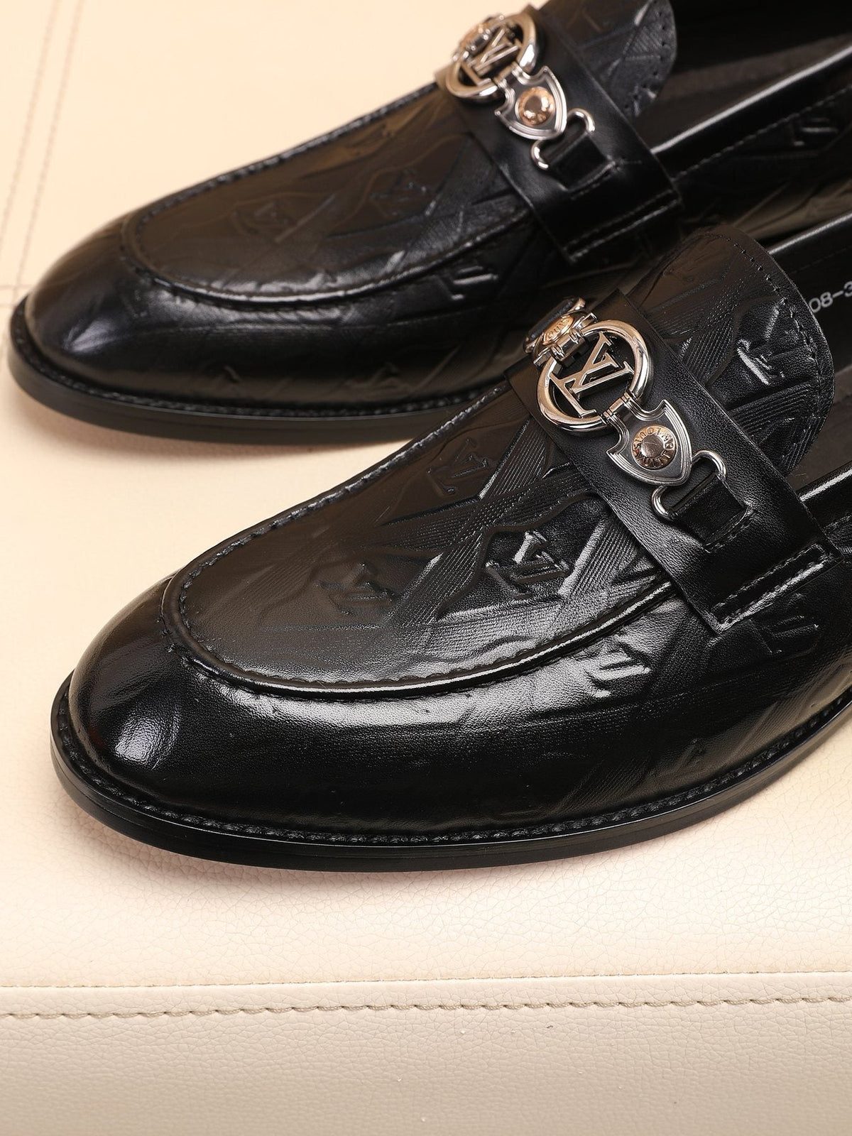 Louis Vuitton Black Embossed Loafers — detail
