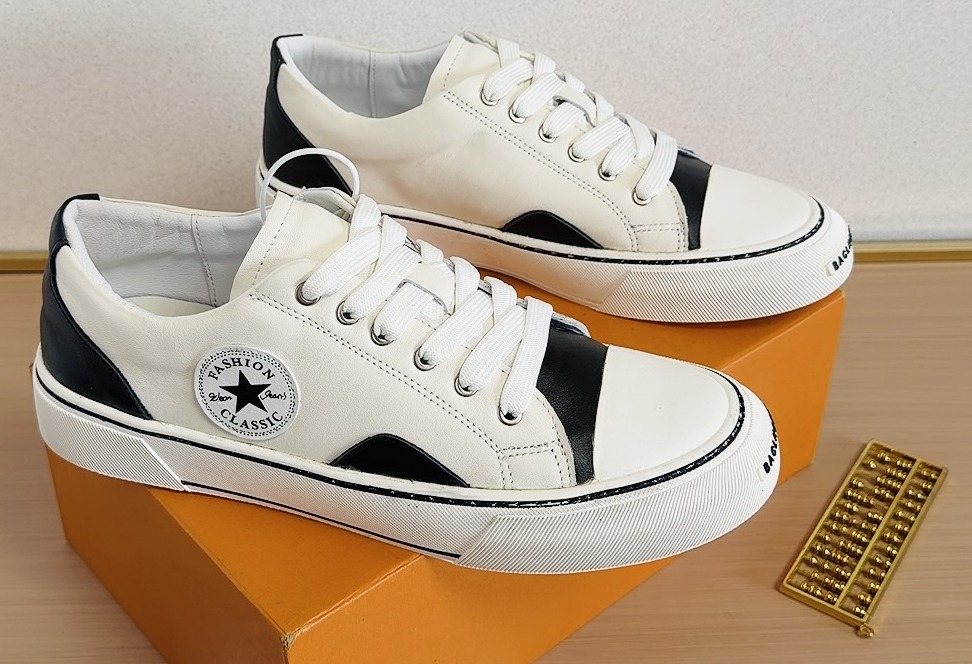 Converse White and Black Low-Top Sneakers — hero