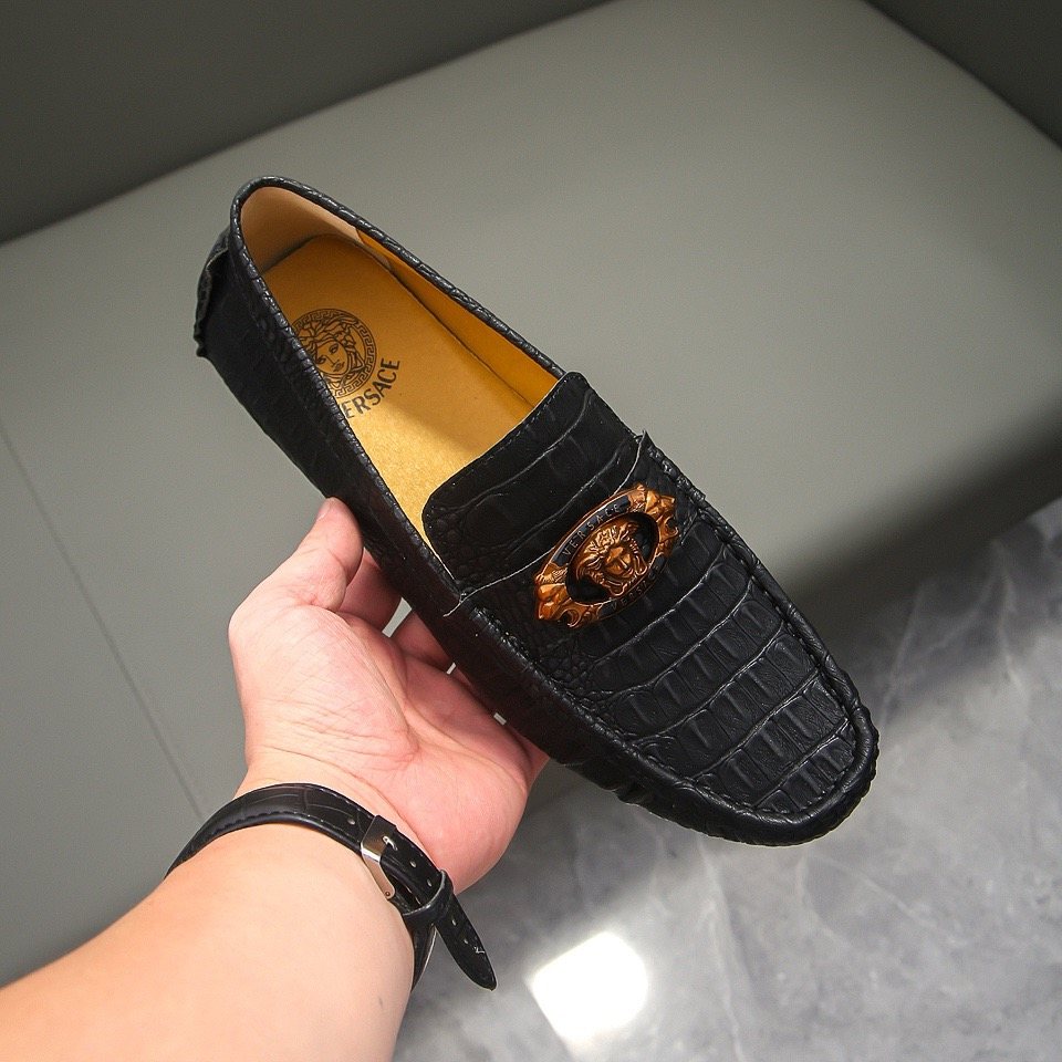 Men's Black Textured Loafers with Gold-Tone Ornament — model