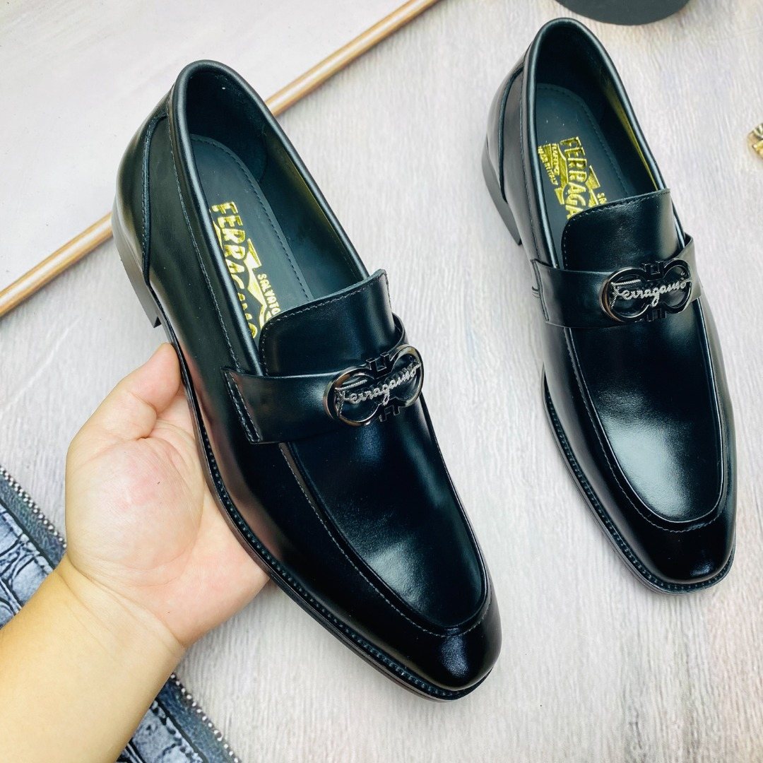 Ferragamo Black Metal-Accent Loafers — model