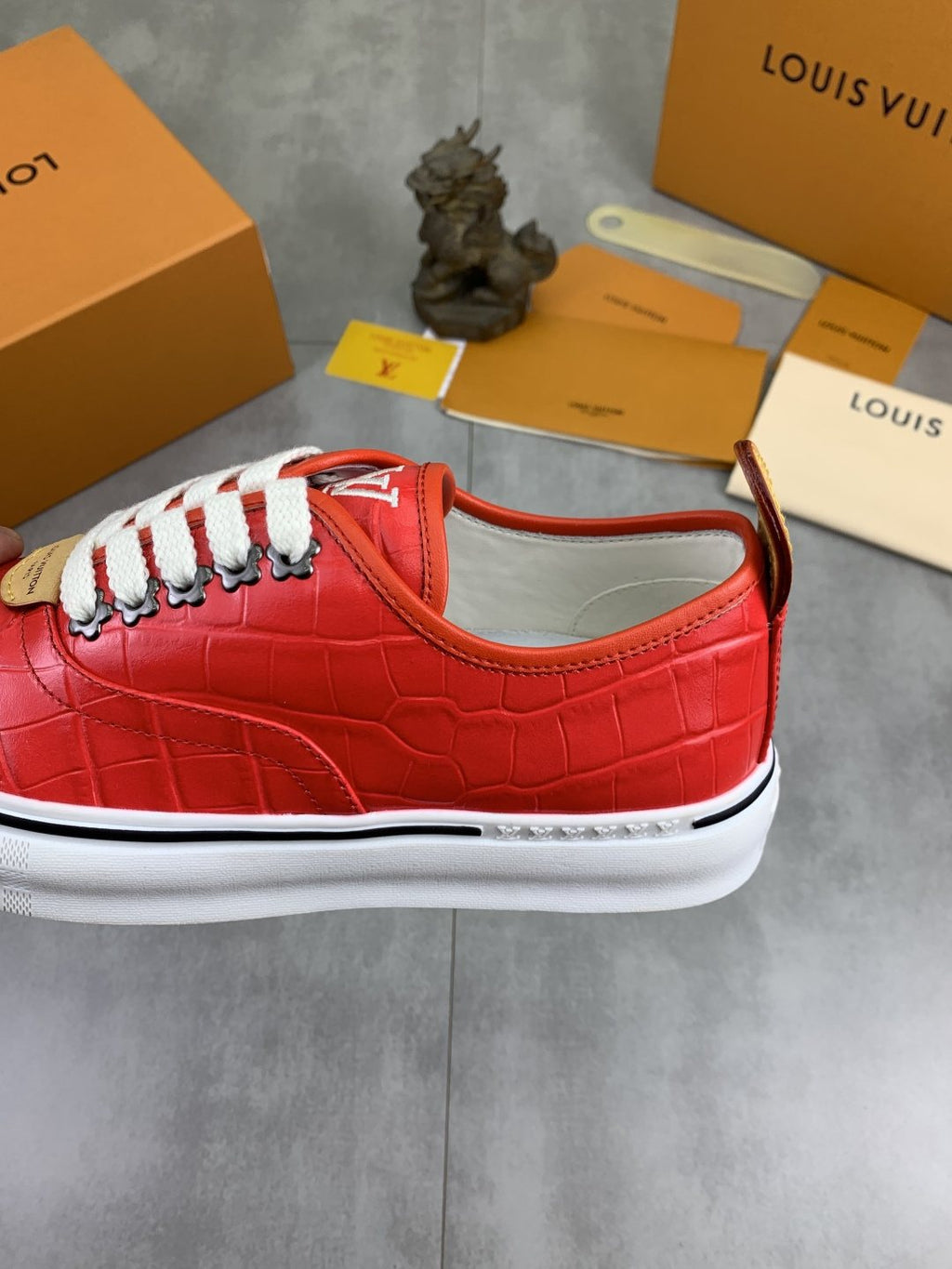 Louis Vuitton Red Embossed Low-Top Sneakers — detail