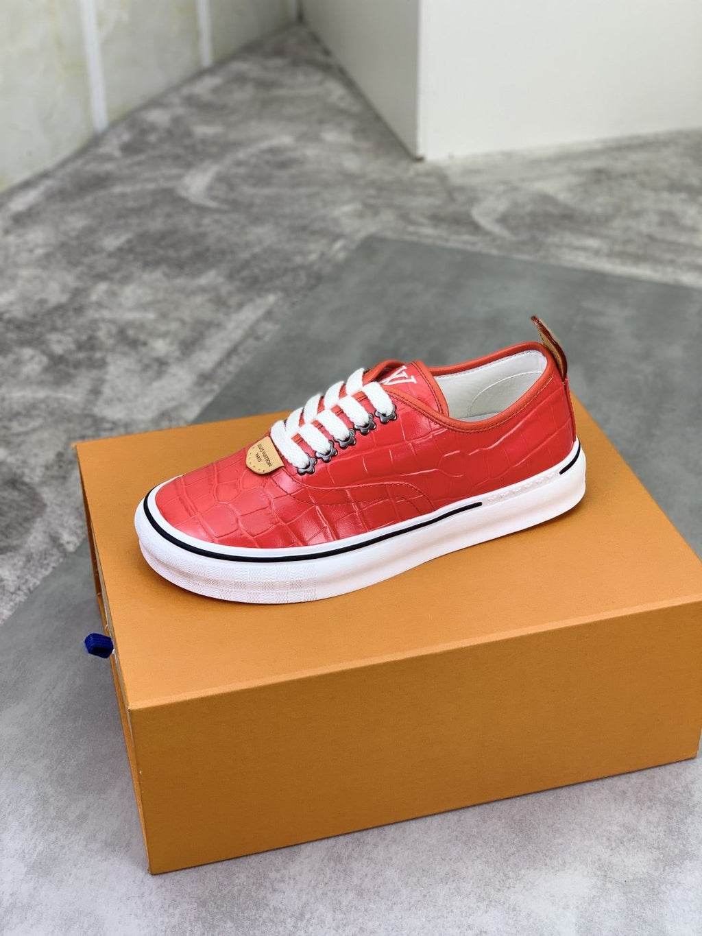 Louis Vuitton Red Embossed Low-Top Sneakers — side