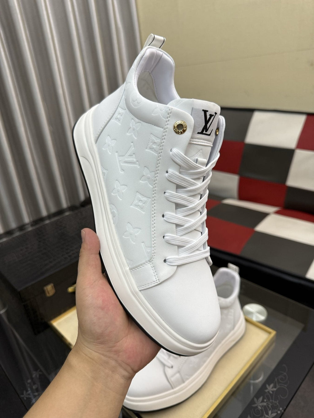 Louis Vuitton Embossed High-Top Sneakers — front