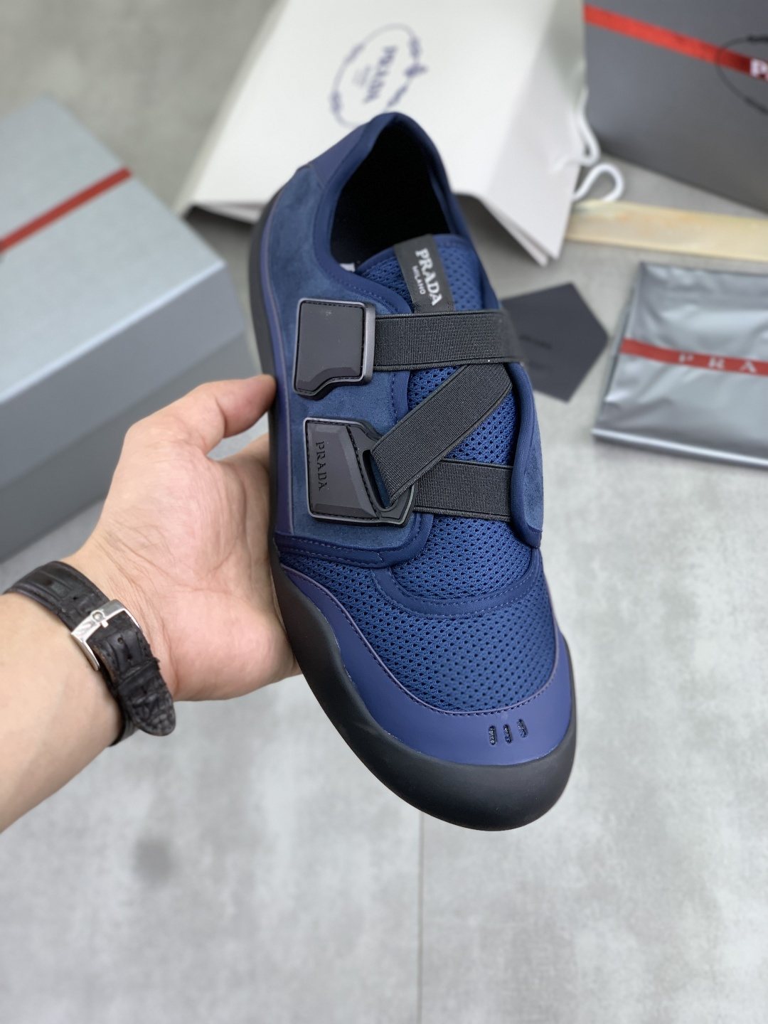 Prada Cross-Strap Low-Top Sneakers — model