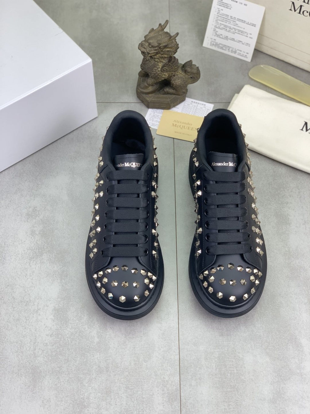 Alexander McQueen Black Studded Low-Top Sneakers — hero